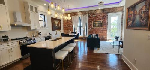 a kitchen with a large island in a room at The Luxe Building- 2 Bedroom Apartment in Metropolis in Metropolis