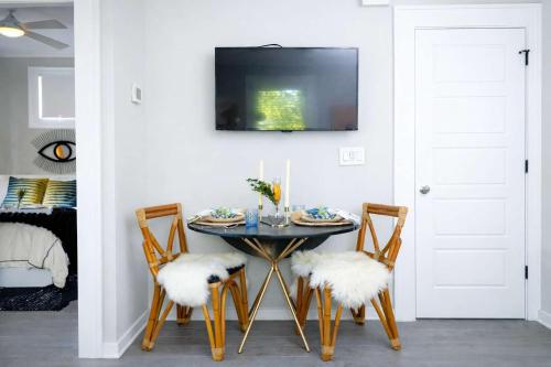 a dining room with a table and two chairs at Prospect in Atlanta