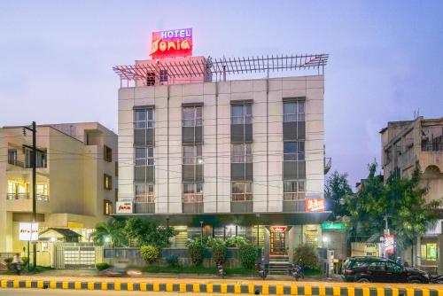 a hotel building with a sign on top of it at Hotel Sonia CIDCO in Aurangabad