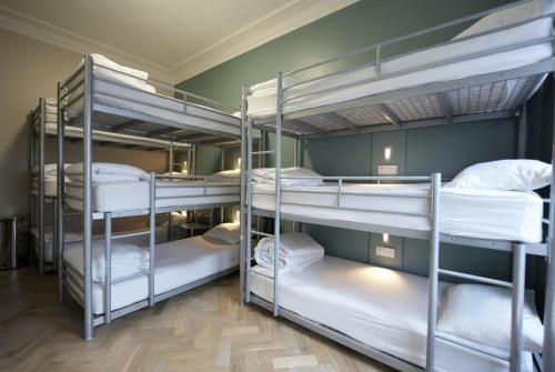 a group of bunk beds in a room at Revolver Edinburgh in Edinburgh