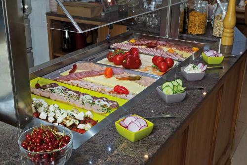 a buffet line with many different types of food at Hotel Anker in Bodman-Ludwigshafen