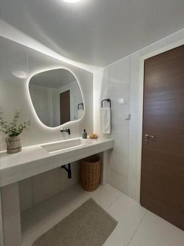 a bathroom with a sink and a mirror at Villa Elia in Mélanes