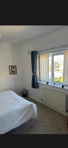 a bedroom with a bed and a window at Conner house in Middlesbrough