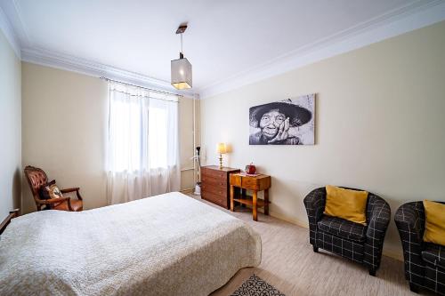 Rúm í herbergi á Guido apartament