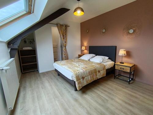 a bedroom with a bed and a stair case at Camping Les Goélands in Ambon