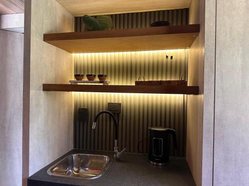 a kitchen with a sink and a counter top at LÜN Lodges in Chacras de Coria