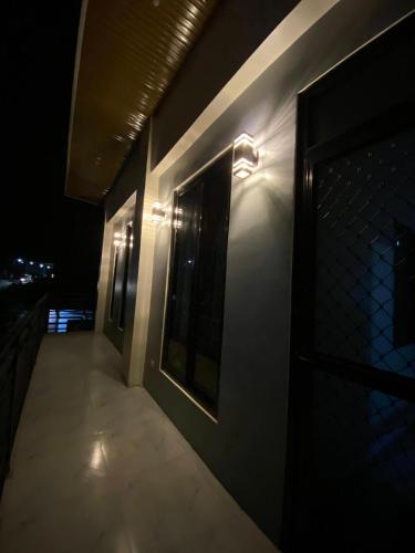 a room with lights on the side of a building at Baldonado Transient Homestay in San Isidro