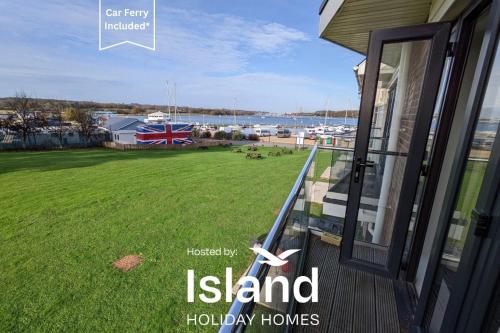 an open door to a house with a view of a field at Folly View in Newport