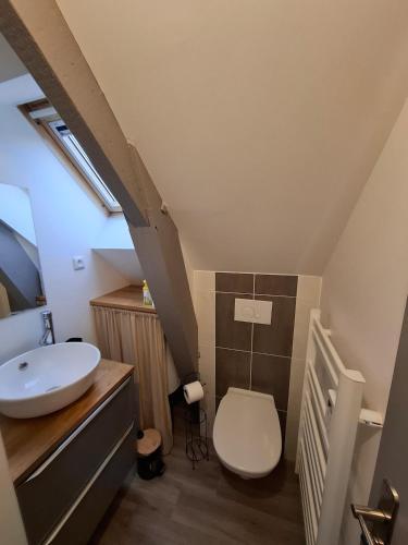 a bathroom with a sink and a toilet at Studio l'écluse in Le Tréport