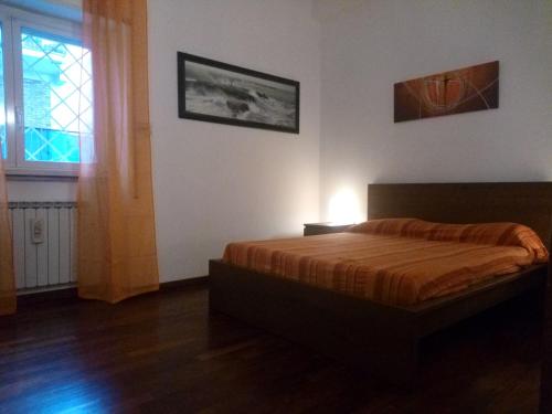 a bedroom with a bed and a window at La Casa di Nonna Betta in Rome