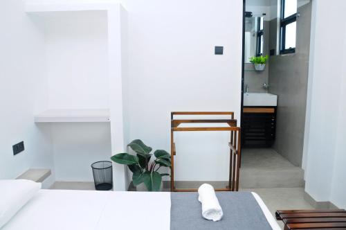 a bedroom with a bed and a table and a mirror at Sky Haven in Matara