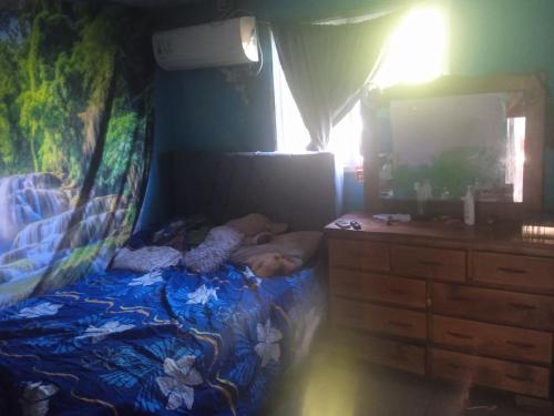 Llit o llits en una habitació de Bagala