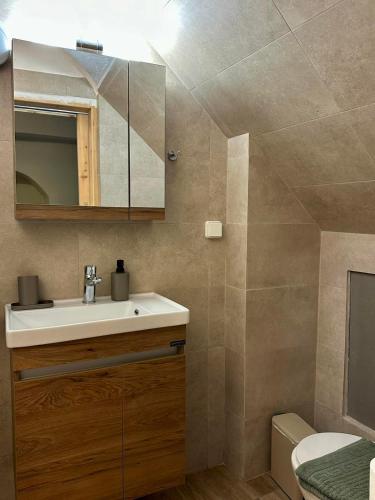 a bathroom with a sink and a mirror at Symi Central Point in Symi