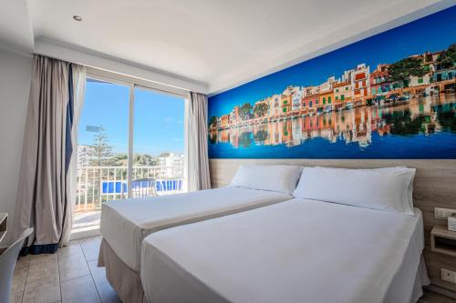 a bedroom with a large bed and a large window at NURA Boreal in Playa de Palma