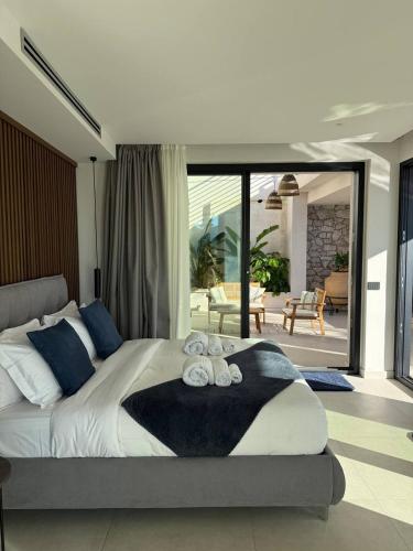 a bedroom with a large bed with towels on it at Villa Ada in Taormina