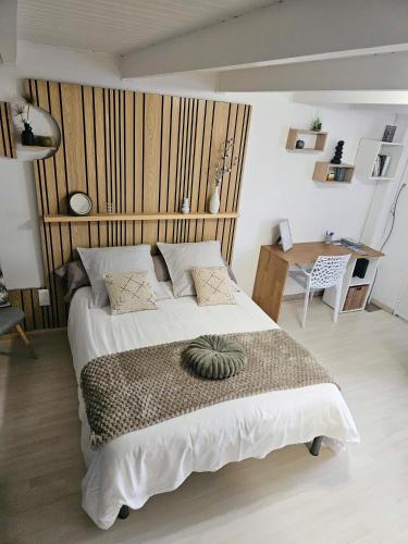 En eller flere senge i et værelse på Le Cottage