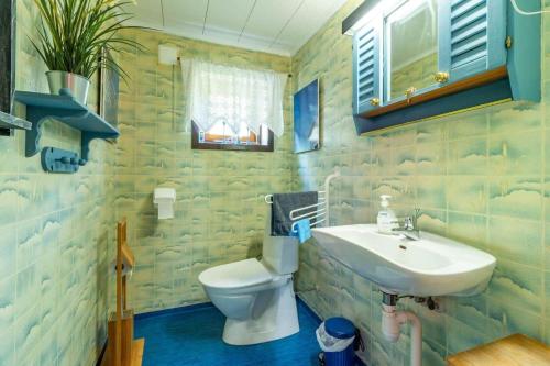 a bathroom with a sink and a toilet at KRO906-Lidhult-Torseryd-4 in Lidhult