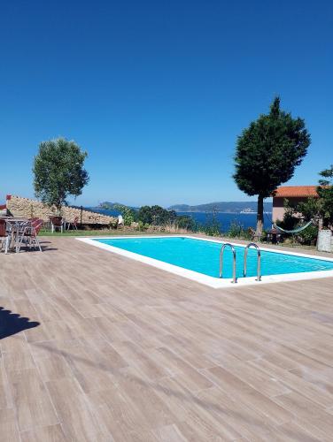 a swimming pool in a villa with a view at Eira de Mantoño in Mantoño