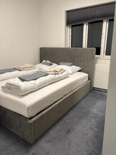 two beds sitting next to each other in a room at Spacious & Cozy home with open kitchen lounge in Søborg