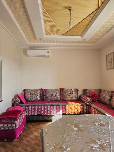a living room with a couch and a table at Appartement stylia 2 in Agadir