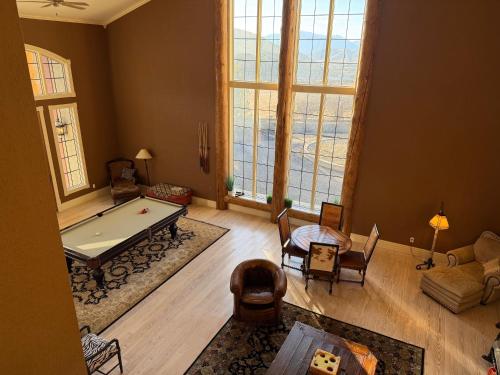 a large living room with a pool table in it at Erik's Ranch in Livingston