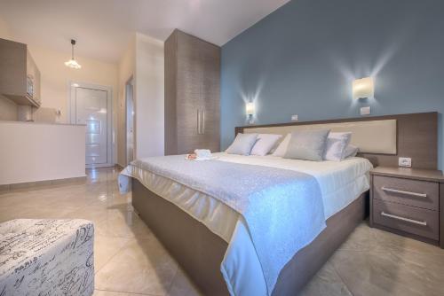 a bedroom with a large bed in a room at Reparo Studios in Lithakia