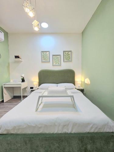 a bedroom with a large white bed in a room at Green Zen Studio Metro 15 mins walk away in Dubai