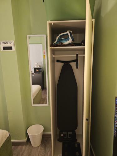 a room with a closet with a mirror and a bed at Green Zen Studio Metro 15 mins walk away in Dubai