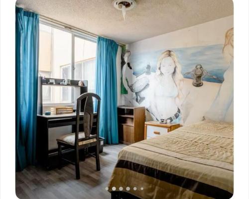 a bedroom with a desk and a bed with blue curtains at Near Everything and Some Art in Mexico City