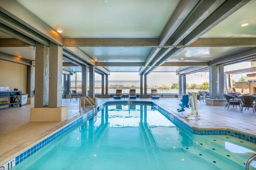 a swimming pool with blue water in a building at The Lodge at Columbia Point in Richland
