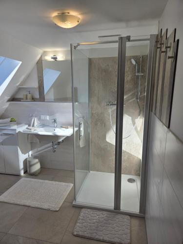 a bathroom with a shower and a sink at Zu-Haus in Peterdorf