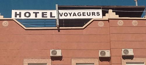 a sign on the top of a hotelroxagency at Hotel Des voyageur in Ouarzazate