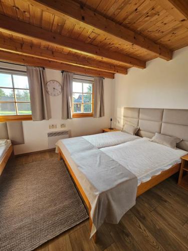 a bedroom with a large bed in a room at Tatralandia Chatka 112 in Liptovský Mikuláš