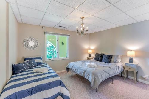 a bedroom with two beds and a window at Yellowhammer Hill - Amenities Galore! Near Cullman in Cullman