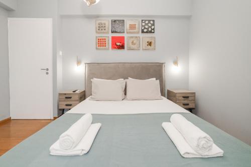 เตียงในห้องที่ Acropolis experience apartment!