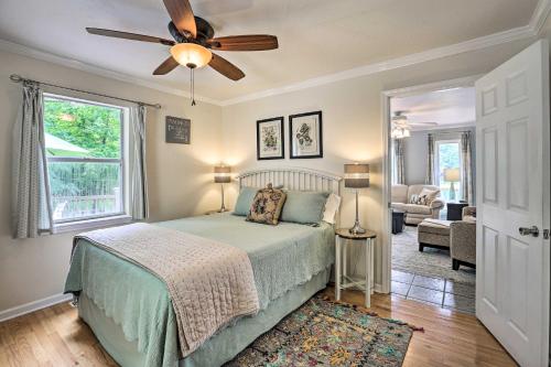 a bedroom with a bed and a ceiling fan at Cranes Nest - Huge Dock With Two Kayaks For The Guest's Use! in Crane Hill