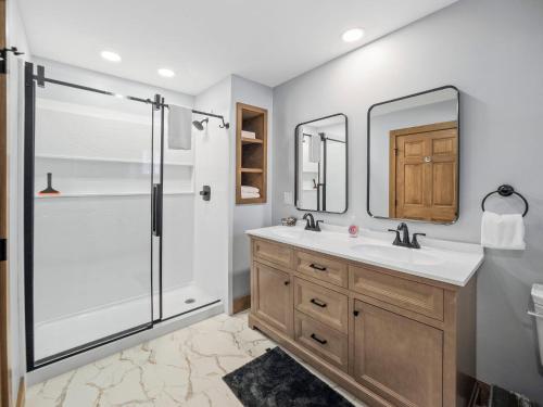 a bathroom with a sink and a shower at 658 Disciples Village Condo in Boyne Falls