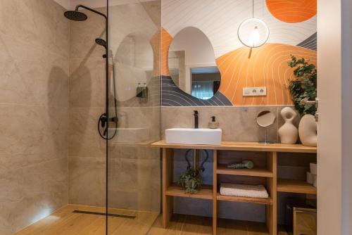 a bathroom with a shower and a sink at Őri Art Inn in Őriszentpéter