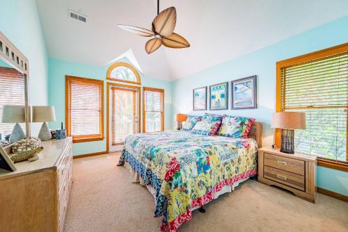 a bedroom with a bed and a dresser and windows at Sunset Royale - Duck, Sanderling, Soundfront, Sound View, Beach 350 Yds, Community Pool, Kayak, YR Flex Stays in Duck