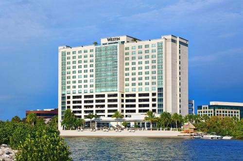 a hotel building with a beach in front of it at The Westin Tampa Bay in Tampa