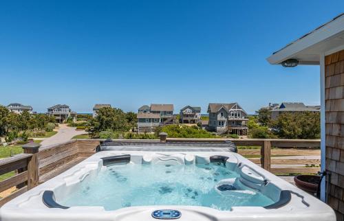 a hot tub on the deck of a house at Duck Diamond - Sanderling, Ocean View, 95 Yds to Beach, Hot Tub, Sauna, Community Pool in Duck