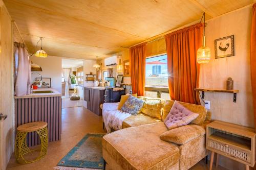 a living room with a couch and a table at The Outpost Grand Canyon in Williams