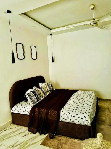 Postel nebo postele na pokoji v ubytování appartement oumy