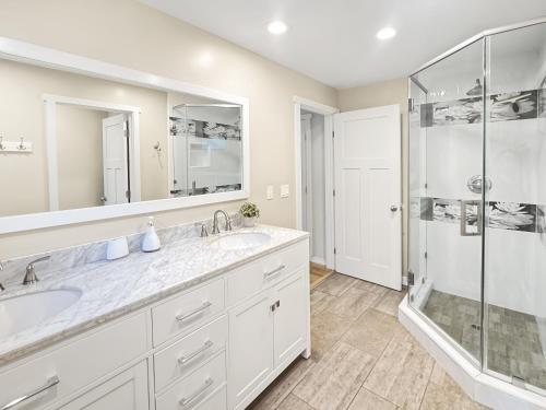 a bathroom with two sinks and a shower at F-60 Disney Dream Craftsman in Anaheim