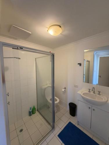 a bathroom with a shower and a sink and a toilet at In the heart of Adelaide in Adelaide