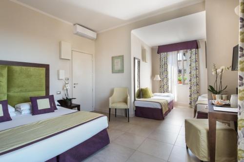 Postel nebo postele na pokoji v ubytování Hotel Perseo