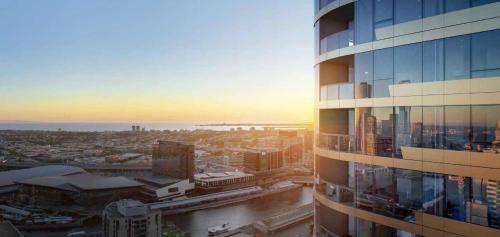 a view of a city from a tall building at High Rise CBD Apartment with Amazing Views, 3 beds, Gym,SPA & Pool, Easy Transport in Melbourne