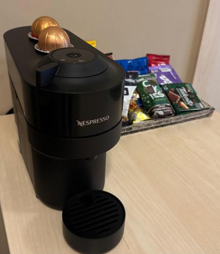 a nissos camera is sitting on a table at Flat Mont Blanc Premium in Ribeirão Preto