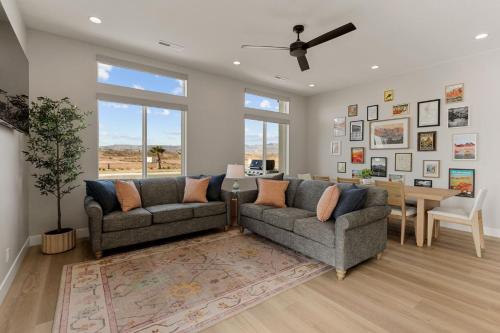 a living room with two couches and a table at Terra Rossa townhouse in St. George