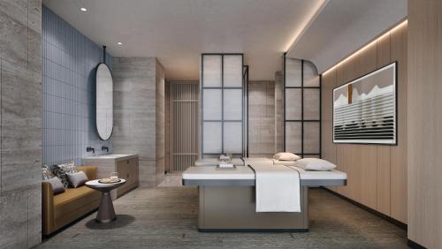 a bathroom with a white sink and a mirror at Sheraton Vinh in Yên Thinh (1)